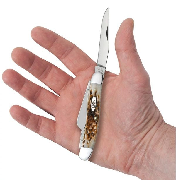 Case XX Amber Bone Peach Seed Jig Medium Stockman